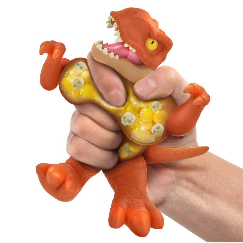Hand squeezing a crunchy-filled Goo Jitzu dinosaur